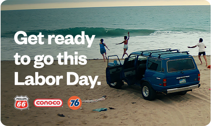 Get ready to go this Labor Day. People parked on a beach running towards the water.